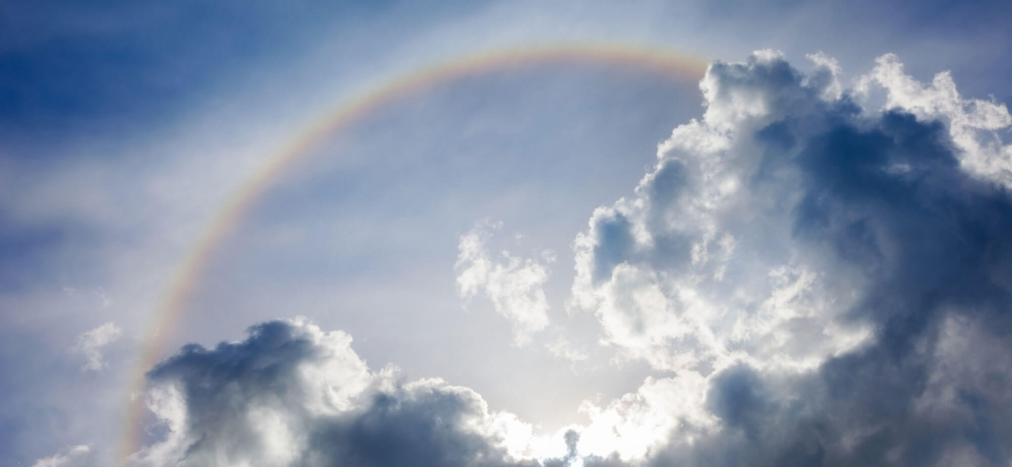 Rainbow in the sky with clouds