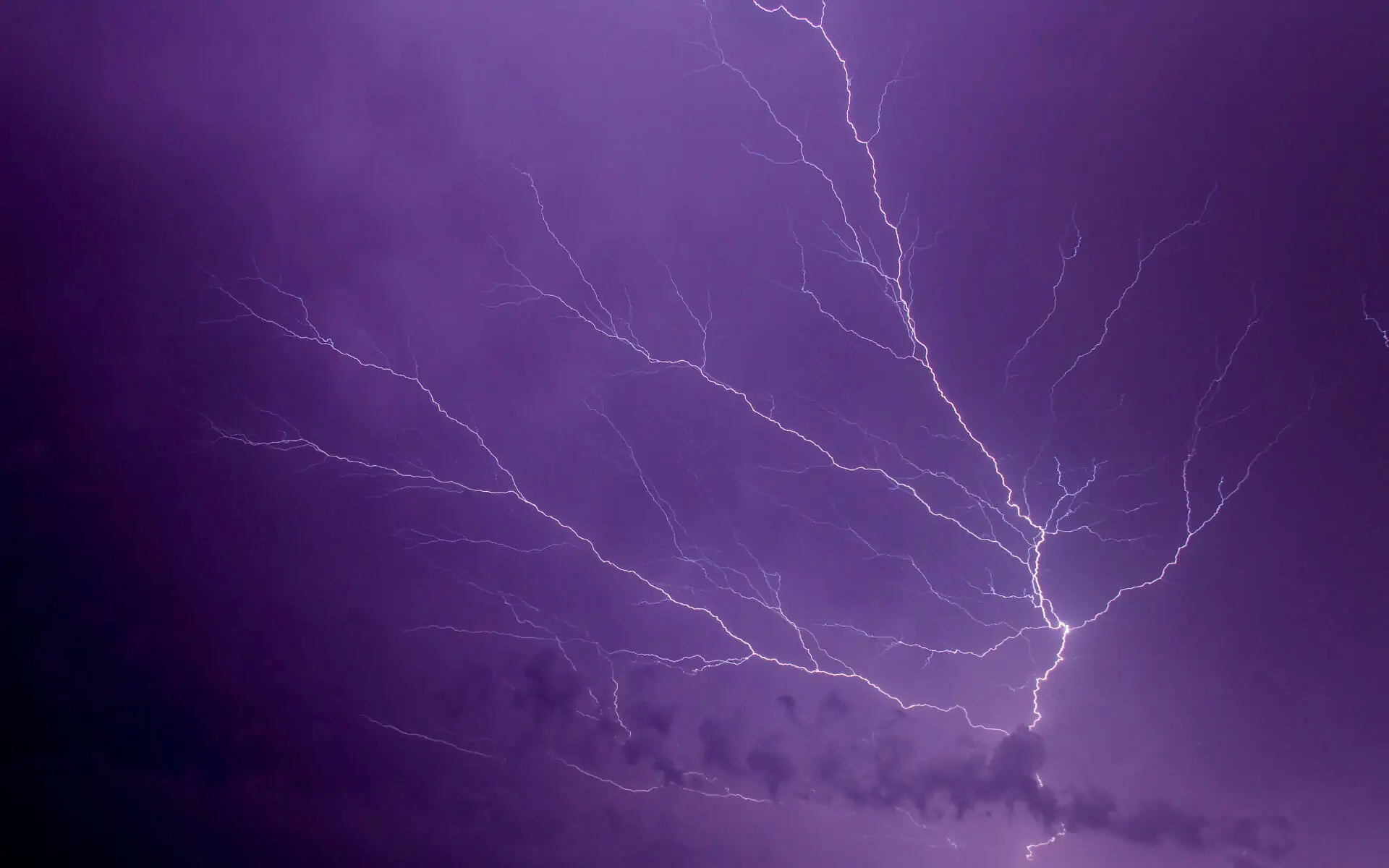 Night sky lit up by lightning, symbolizing the near instant nature of emotional triggers.